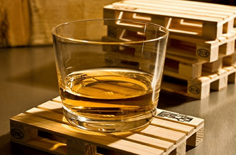 glass of whiskey on pallet