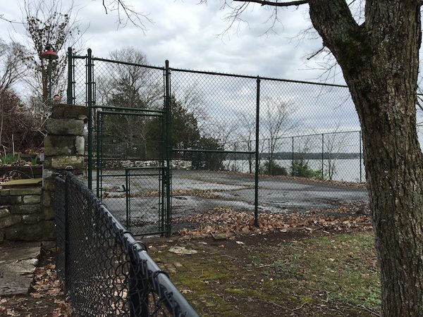 The Cash's gated tennis court.