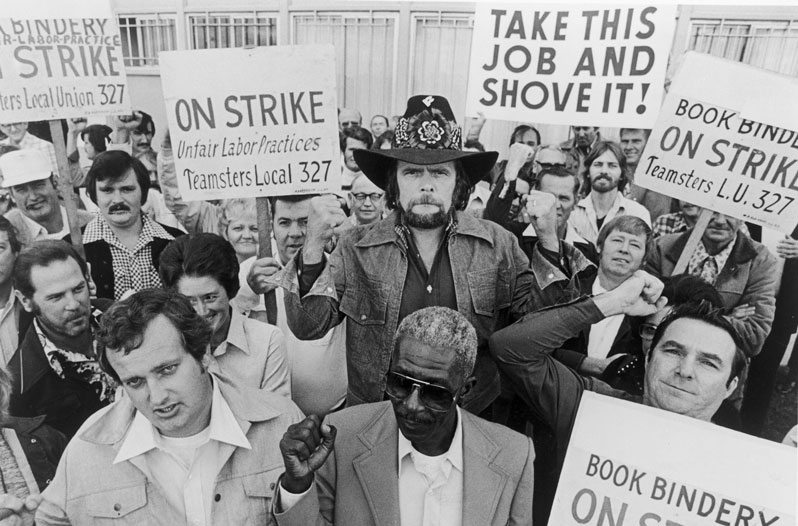 UNSPECIFIED - CIRCA 1970: Photo of Johnny Paycheck at a demonstration.