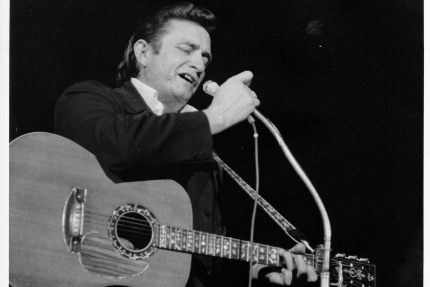 Country singer/songwriter Johnny Cash performs onstage in 1968 in Los Angeles, California.