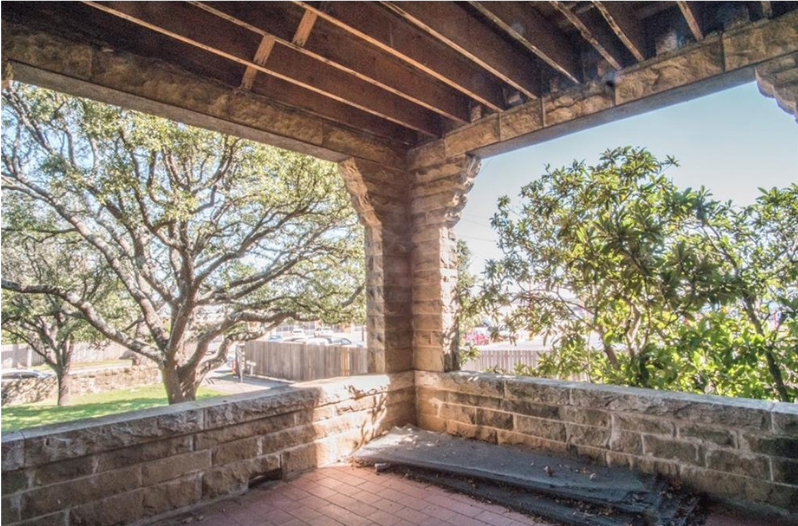A covered brick outdoor entertaining area on the Cottonland Castle property