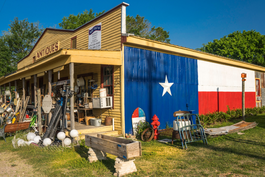Antique Store, Texas Hill country outside of Austin Texas shows large Lone Star Texas Flag.