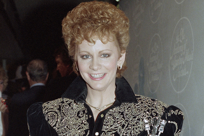 Reba McEntire holds her Academy of Country Music Award for top female vocalist at the Country Awards in Buena Park, Calif. on Monday, April 15, 1986.