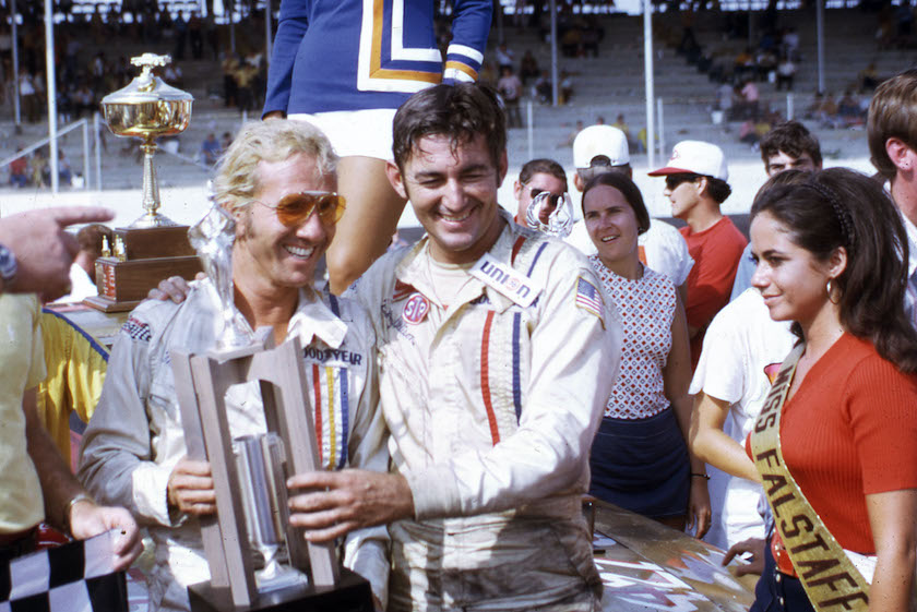 DARLINGTON, SC — September 6, 1971: Marty Robbins (L) joins Bobby Allison in victory lane at Darlington Raceway after Allison won the Southern 500 NASCAR Cup race. Country music entertainer Robbins, who dabbled in Cup racing off and on, had one of his best career finishes in the event, taking seventh place. 