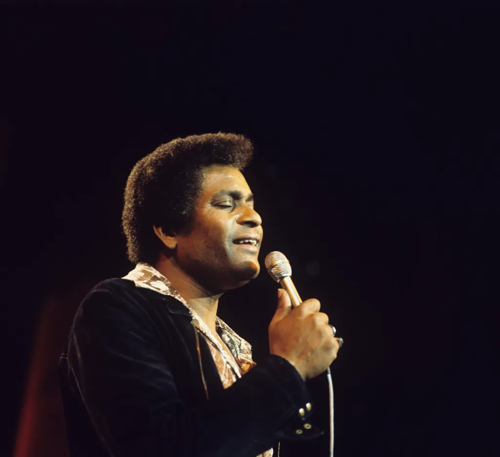  Singer Charley Pride performs on stage in the 1970s.