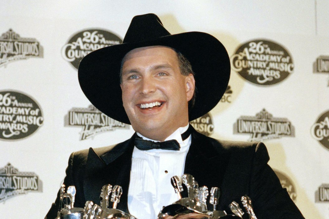 Garth Brooks displays the six trophies he won throughout the night, April 26, 1991 at the 26th Annual Academy of Country Music Awards in Universal City, California. Brooks won for album, song, video and record of the year as well as being named Top Male Vocalist and Entertainer of the Year.