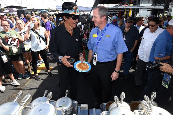 BRISTOL, TN - AUGUST 20: Team owner Richard Petty and Walt Ehmer, CEO of Waffle House, make waffles prior to the NASCAR Sprint Cup Series Bass Pro Shops NRA Night Race at Bristol Motor Speedway on August 20, 2016 in Bristol, Tennessee.