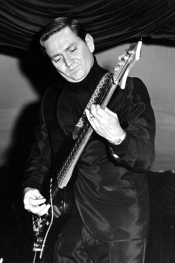 CIRCA 1961: Country singer/songwriter Willie Nelson plays bass as he performs onstage in circa 1961.