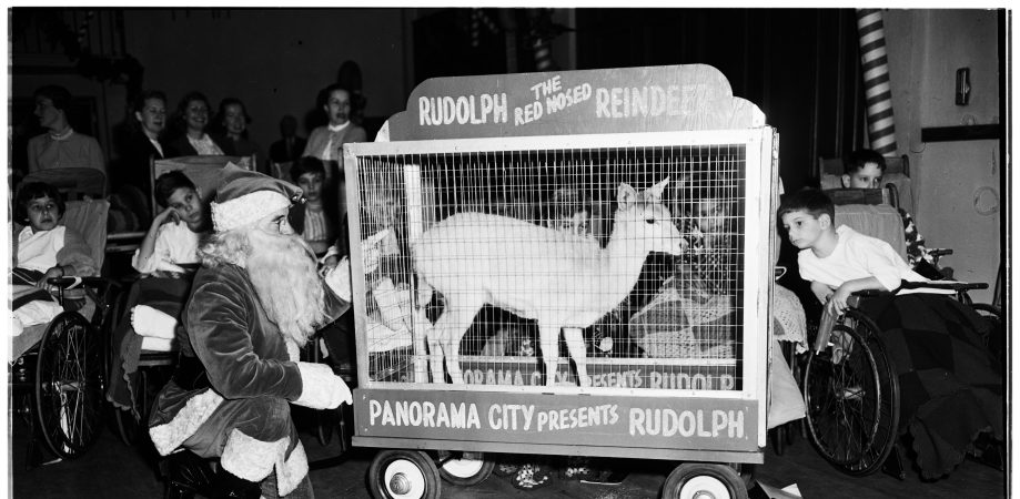 Christmas Party at Orthopaedic Hospital Given by Juniors of League for Crippled Children, 22 December 1951. Santa and Rudolph, the Red-Nosed Reindeer, entertain the kids at the hospital.Los Angeles; California; USA; Orthopaedic Hospital.