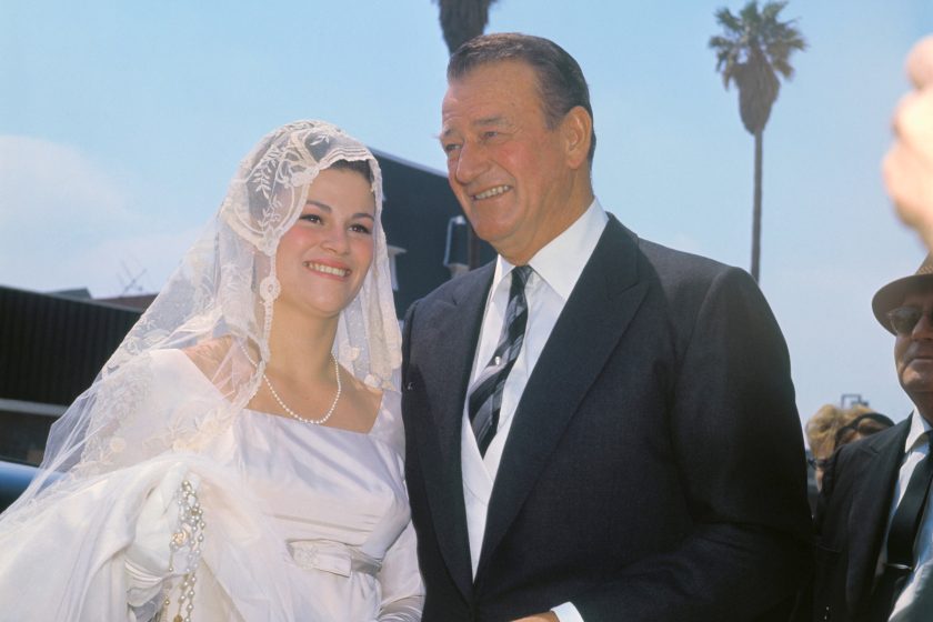 ohn Wayne with his daughter Melinda Ann on her wedding day. Her new husband is Gregory Robert Munoz.