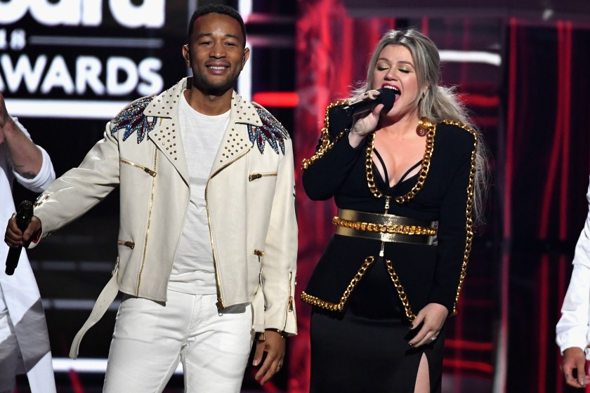 LAS VEGAS, NV - MAY 20: Recording artists John Legend and Kelly Clarkson speak onstage during the 2018 Billboard Music Awards at MGM Grand Garden Arena on May 20, 2018 in Las Vegas, Nevada.