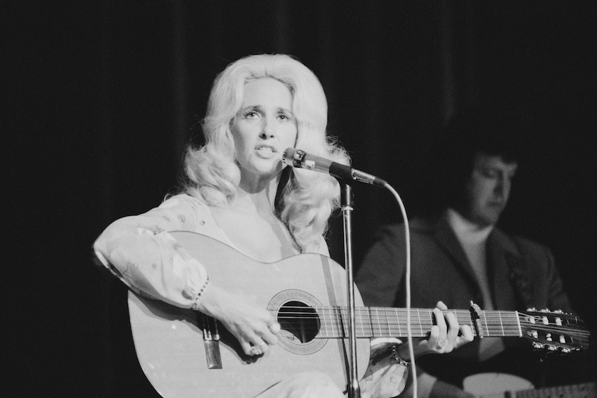 American country music singer-songwriter Tammy Wynette (1942 - 1998) performing at the Hammersmith Odeon, London, June 1975.