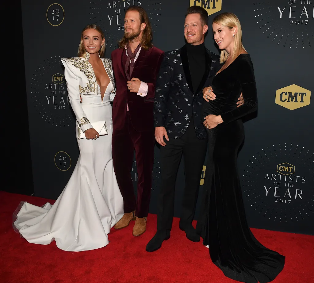NASHVILLE, TN - OCTOBER 18: Recording Artists Brian Kelley and Tyler Hubbard of Florida Georgia Line arrive with their wives Brittany Cole and Hayley Stommel at the 2017 CMT Artists Of The Year Awards Show at Schermerhorn Symphony Center on October 18, 2017 in Nashville, Tennessee. 