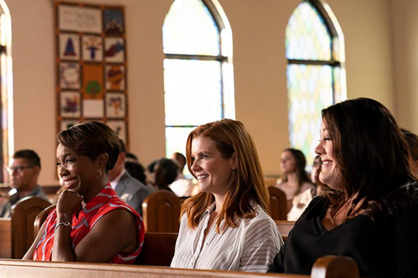 The three Magnolias sitting together in a church pew on Netflix series 'Sweet Magnolias'