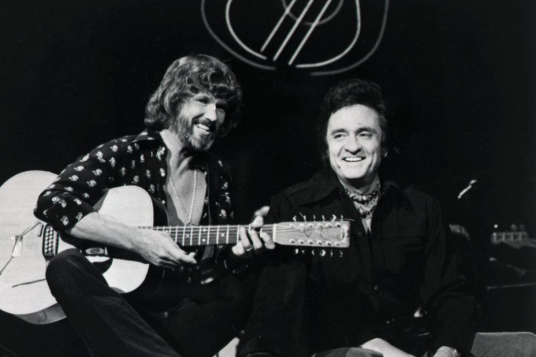 Kris Kristofferson (L) and Johnny Cash perform a duet on "The Johnny Cash Show."