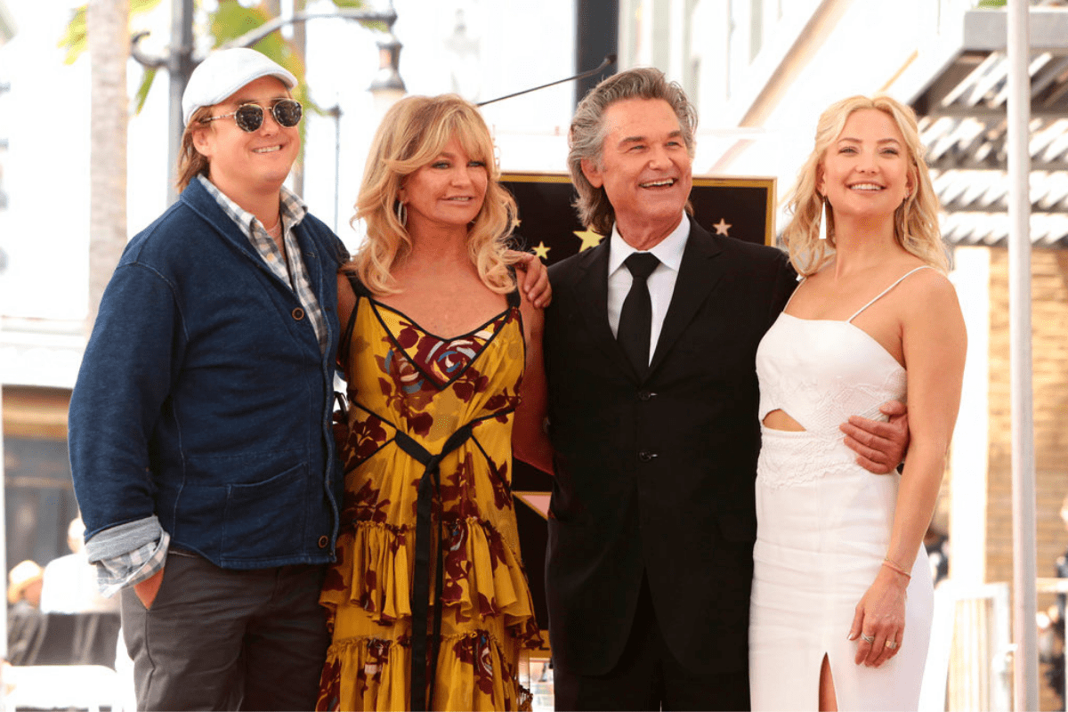 Boston Russell, Goldie Hawn, Kurt Russell, and Goldie Hawn pose at Goldie and Kurt's Hollywood Walk of Fame event
