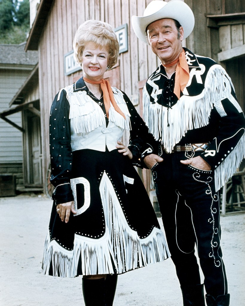 Married American actors Dale Evans (1912 - 2001) and Roy Rogers (1911 - 1998) in western outfits, circa 1965. 