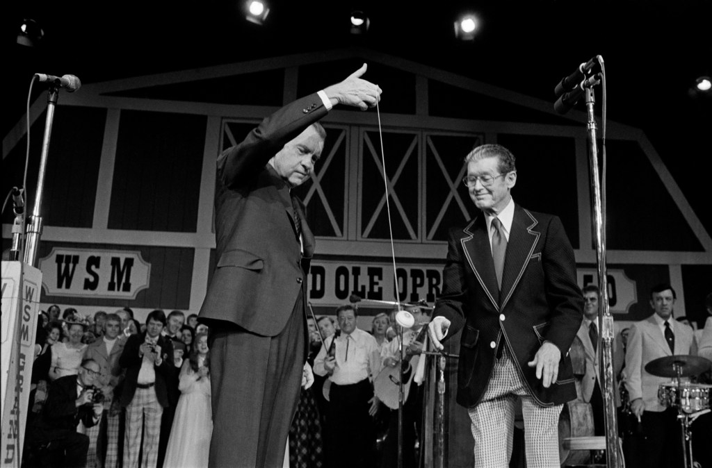 NASHVILLE, TENNESSEE - MARCH 16: (NO U.S. TABLOID SALES) President Richard Nixon demonstrates his yo-yo skills to Roy Acuff March 16, 1974 at the dedication of the new Grand Ole Opry House in Nashville, TN. (Photo by David Hume Kennerly/Getty Images)