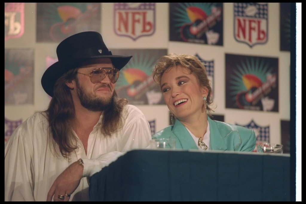 Singers Travis Tritt and Tanya Tucker get interviewed before Super Bowl XXVIII between the Dallas Cowboys and the Buffalo Bills at the Georgia Dome in Atlanta, Georgia.  The Cowboys won the game, 30-13. 
