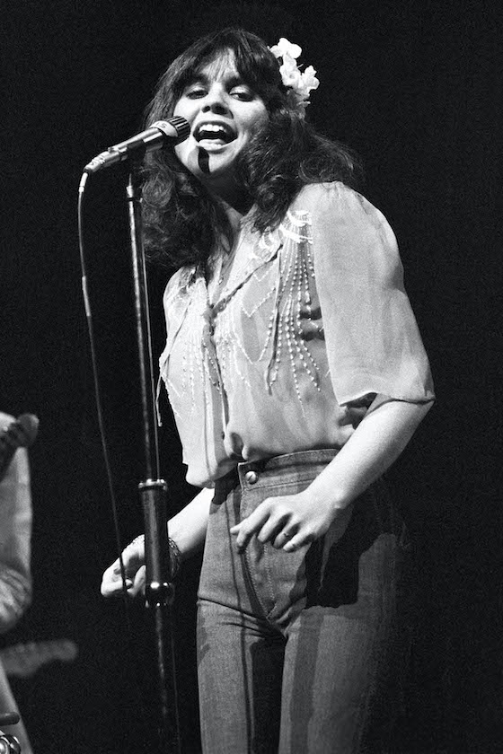 Linda Ronstadt performing on stage at New Victoria Theatre, London, 1974.