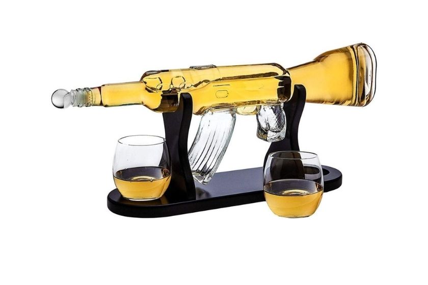 decanter whiskey set in the shape of a rifle (stand holds the decanter up). it comes with two glasses