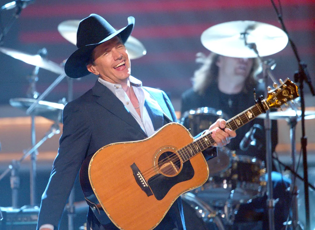 George Strait performs onstage at the "37th Annual CMA Awards" at the Grand Ole Opry House November 5, 2003 in Nashville, Tennessee.