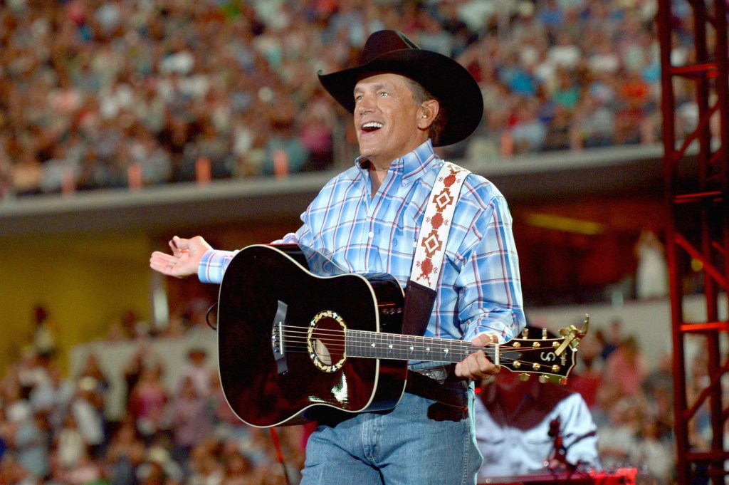 Musician George Strait performs onstage at George Strait's 'The Cowboy Rides Away Tour' final stop at AT&T Stadium at AT&T Stadium on June 7, 2014 in Arlington, Texas. (Photo by Rick Diamond/Getty Images for George Strait)