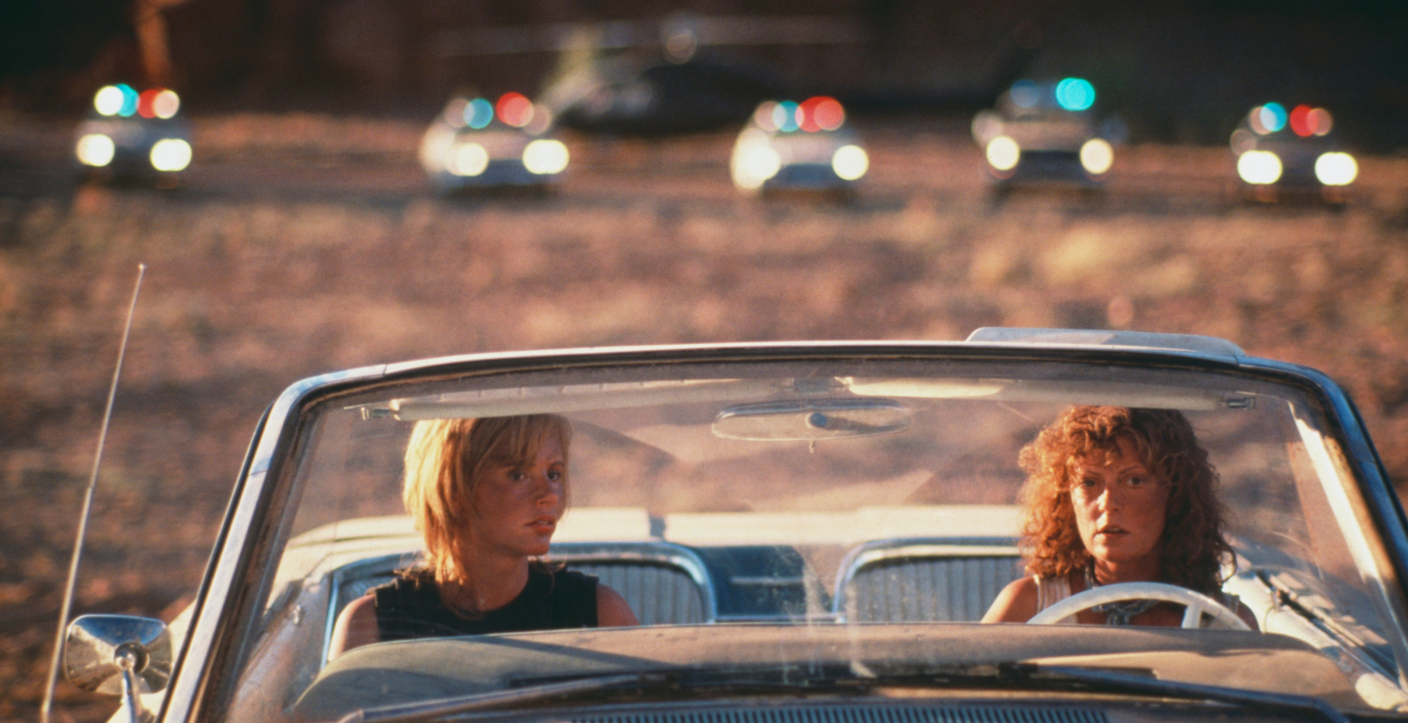Actresses Geena Davis (left) and Susan Sarandon weigh up their options in the film 'Thelma And Louise', 1991