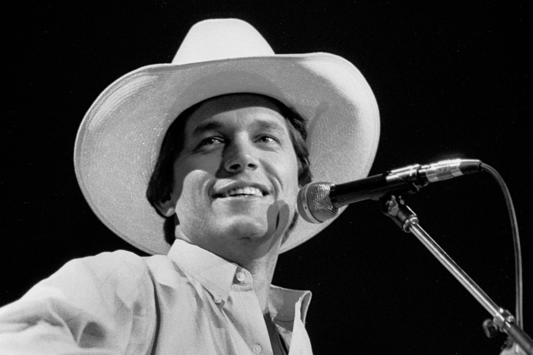 American Country musician George Strait plays guitar as he performs onstage, Fresno, California, April 19, 1985.