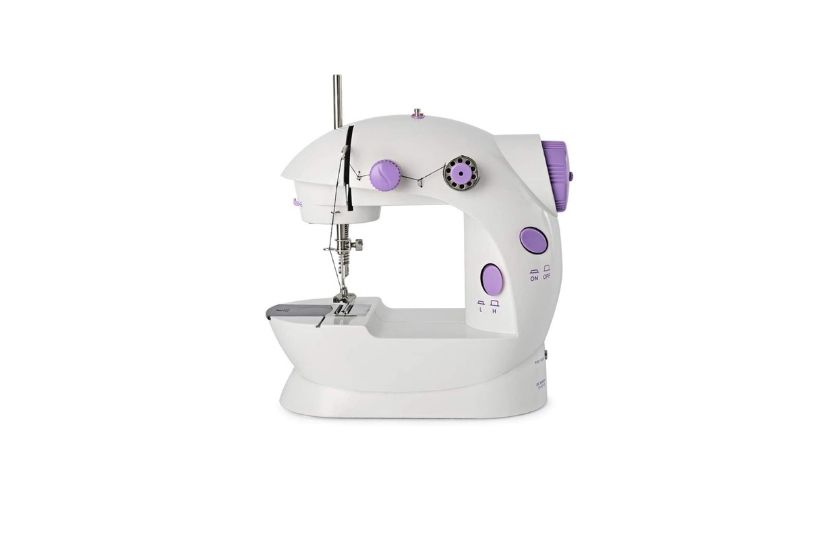 mini sewing machine with white background