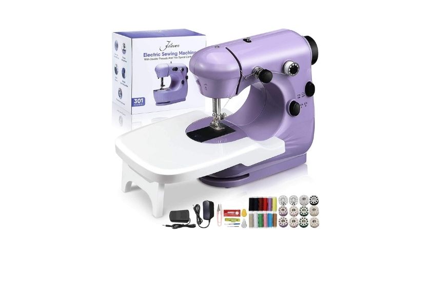 purple mini sewing machine with supplies