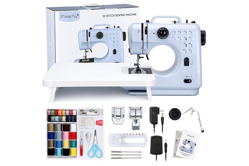 white mini sewing machine with supplies and box