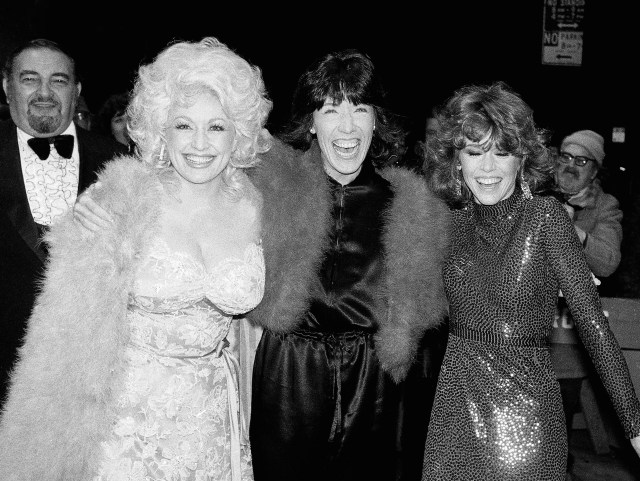Dolly Parton, left, Lily Tomlin, center, and Jan Fonda arrive at New York's Sutton Theater, Sunday, Dec. 14, 1980 for the premiere of the movie, "9 To 5".