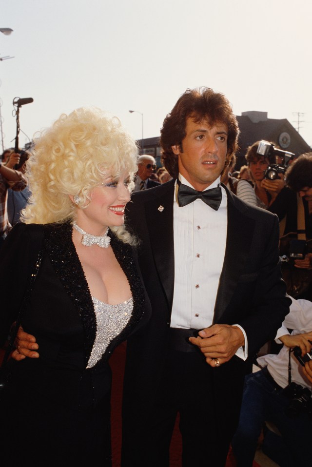 American country music singer and songwriter Dolly Parton and actor, director, screenwriter and producer Sylvester Stallone attend the premiere of the movie Rhinestone, directed by Bob Clark.