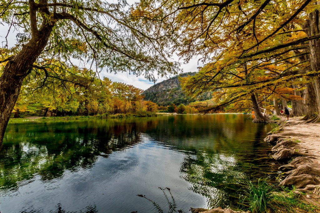 Beautiful Fall Foliage Surrounding the Clear Frio River in Garner State Park, Texas.