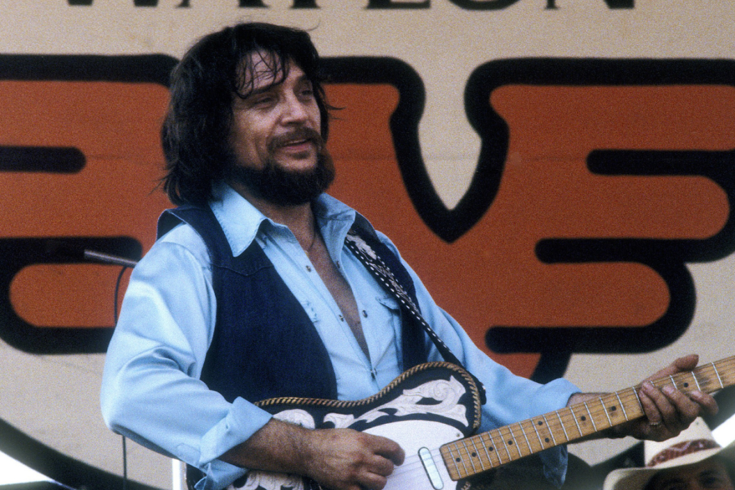 Waylon Jennings performs with 'Willie Nelson' at the Spartan Stadium in San Jose, California on July 26, 1982. (Photo by Larry Hulst/Michael Ochs Archives/Getty Images)