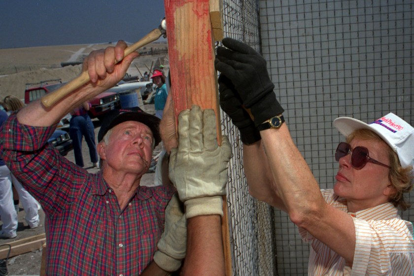On June 18, 1990, former U.S. President Jimmy Carter and his wife Rosalynn help construct one of 100 houses at a Habitat For Humanity project in Tijuana. Like all the volunteers, he and Rosalynn spent two working and two nights in a simple tent. Today, Carter was awarded the 2002 Nobel Peace Prize for his contributions to the world since he left office.