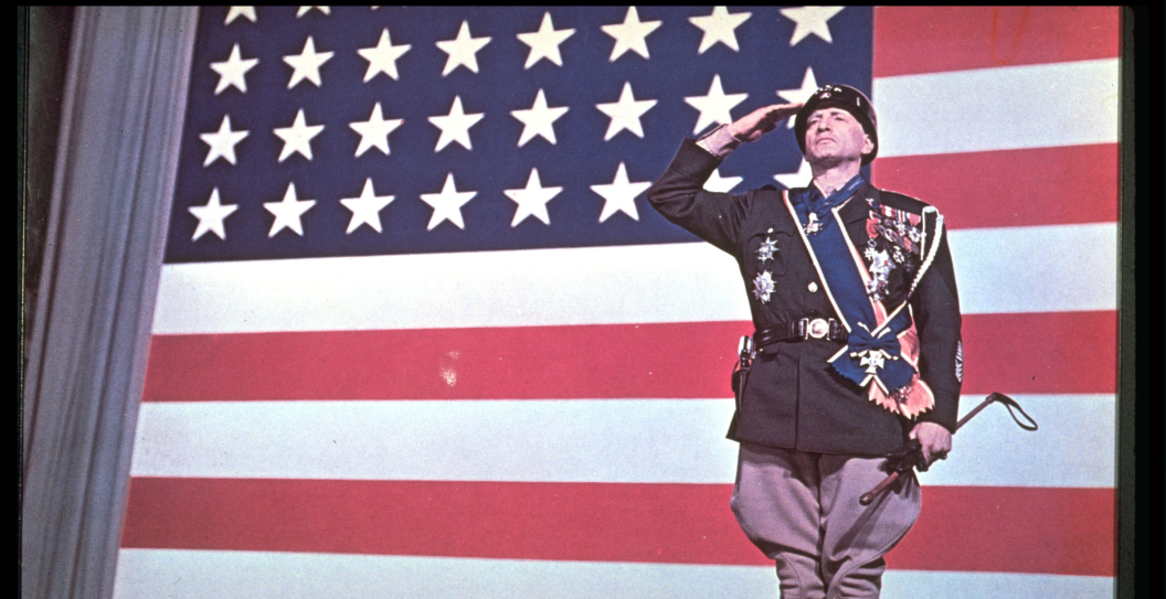 Promotional portrait of American actor George C. Scott (1927- 1999) saluting before an American flag for the film 'Patton,' directed by Franklin Schaffner (1920 - 1989), 1970