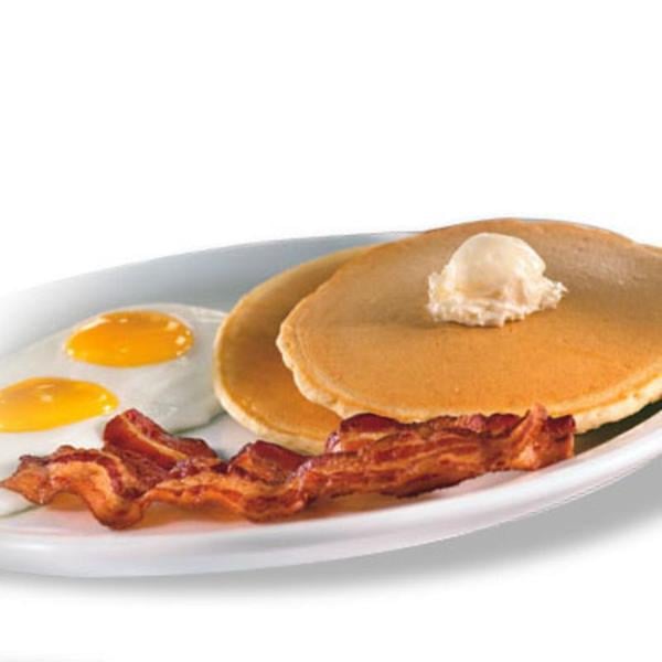 Denny's value menu with pancakes, bacon, and eggs