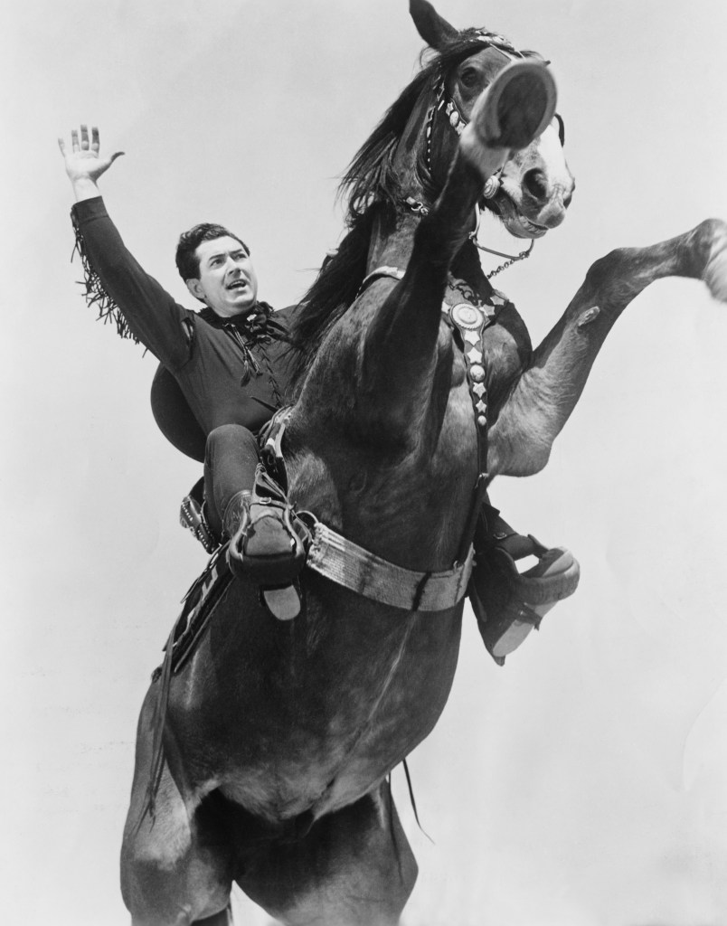 Actor Johnny Mack Brown on Horseback