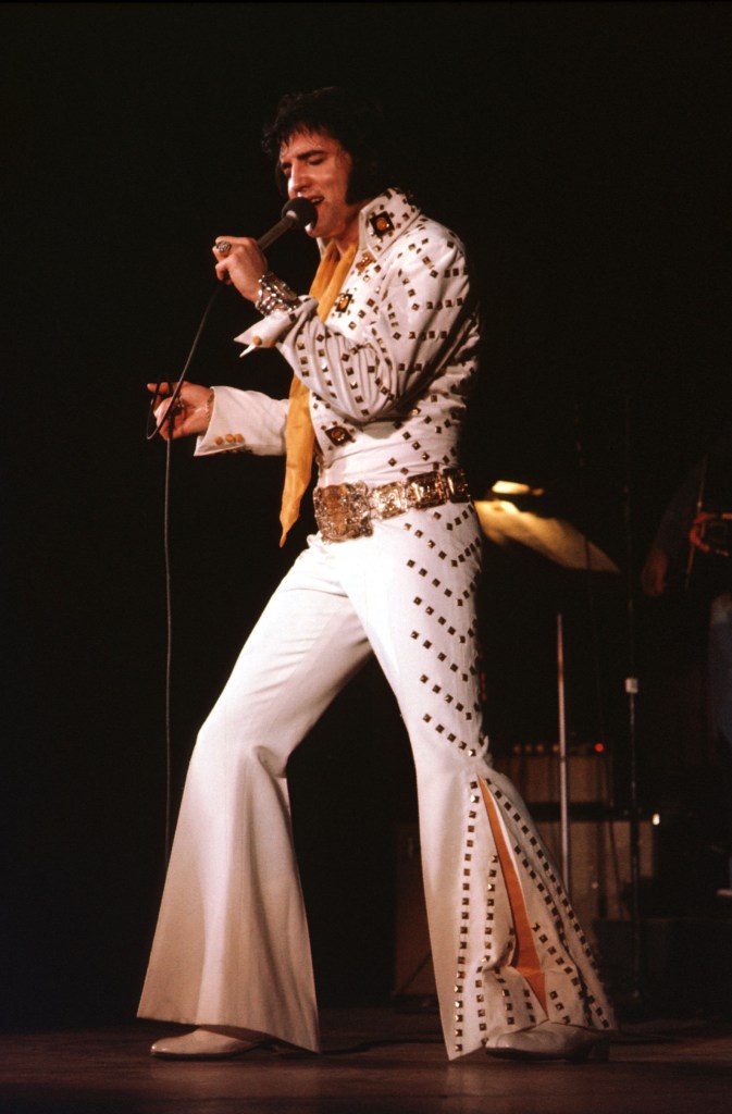 1974: Rock and roll singer Elvis Presley performs on stage in 1974.