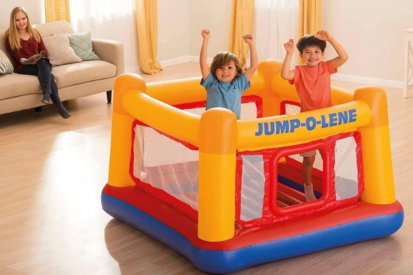 two children having fun in a ball pit for toddlers