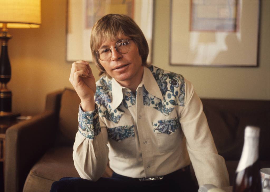 John Denver poses for a portrait in his hotel room in 1979 in Amsterdam, Netherlands.
