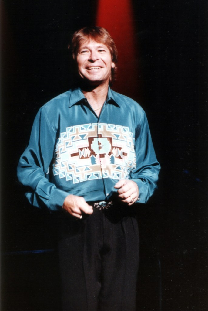 John Denver performs at Northrup Auditorium in Minneapolis, Minnesota on October 5, 1991. 