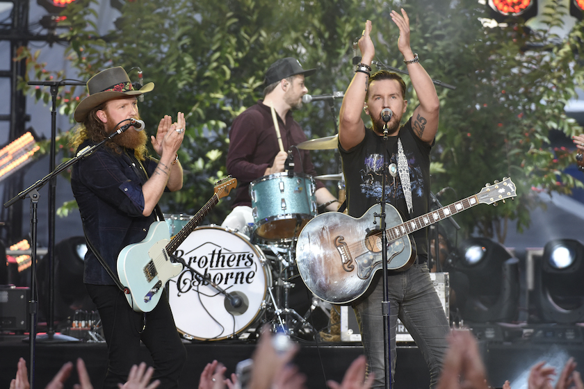 NASHVILLE, TN - JUNE 07: John Osborne (L) and T.J. Osborne of Brothers Osborne perform during the 2017 CMT Music Awards at the Music City Center on June 7, 2017 in Nashville, Tennessee.