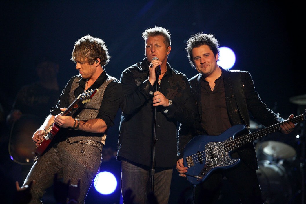 LAS VEGAS - MAY 18: (L-R) Musicians Joe Don Rooney, Gary LeVox, and Jay DeMarcus of the band Rascal Flatts onstage during the 43rd annual Academy Of Country Music Awards held at the MGM Grand Garden Arena on May 18, 2008 in Las Vegas, Nevada.