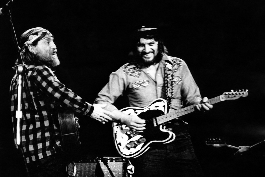 Willie Nelson and Waylon Jennings perform on stage together, New York, April 1978.