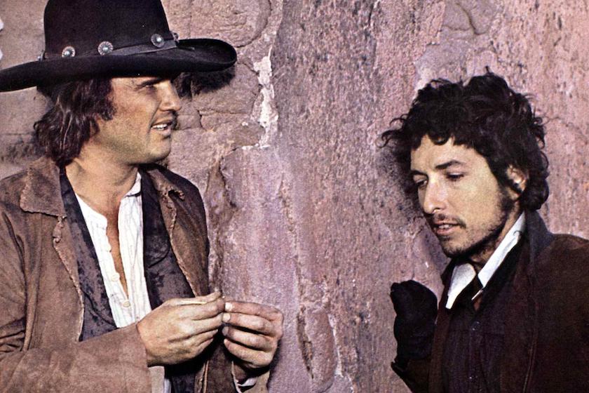 Promotional shot from 'Pat Garrett & Billy the Kid" showing Kris Kristofferson and Bob Dylan