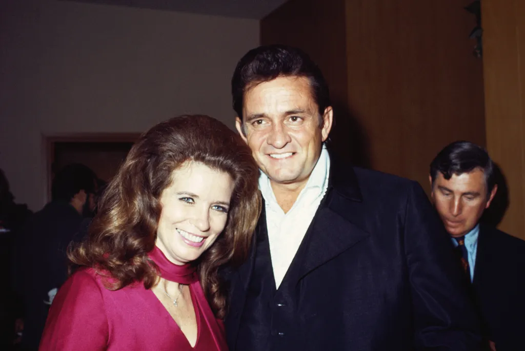 Married country singers Johnny Cash & June Carter Cash pose for a portrait at an event in September 1969 in California.