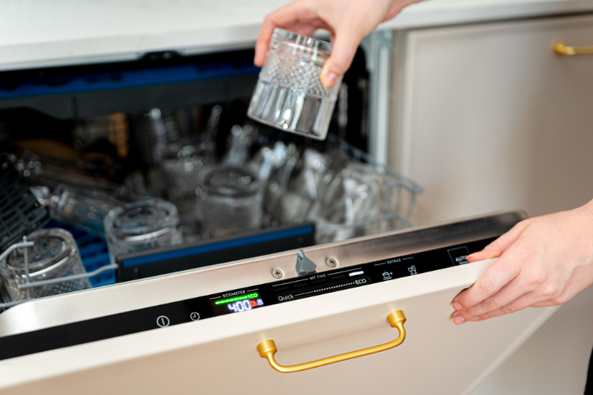 putting glass in dishwasher
